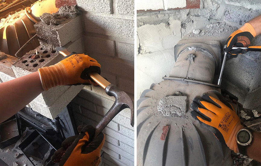 Hände reißen alten Kamin ab